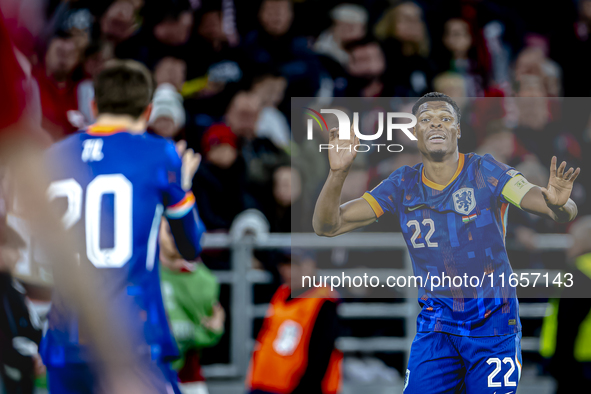 Netherlands defender Denzel Dumfries scores to make it 1-1 and celebrates the goal during the match between Hungary and the Netherlands at t...