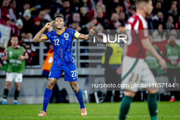 Netherlands defender Denzel Dumfries scores to make it 1-1 and celebrates the goal during the match between Hungary and the Netherlands at t...