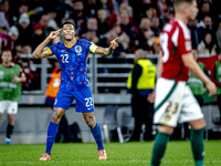 Netherlands defender Denzel Dumfries scores to make it 1-1 and celebrates the goal during the match between Hungary and the Netherlands at t...