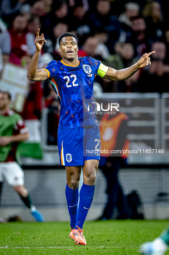 Netherlands defender Denzel Dumfries scores to make it 1-1 and celebrates the goal during the match between Hungary and the Netherlands at t...