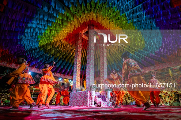 During Garbi organized by RA Garbi Mandal in Jamnagar, India, on Navratri, children worship Adhyashakti traditionally by performing the Raas...