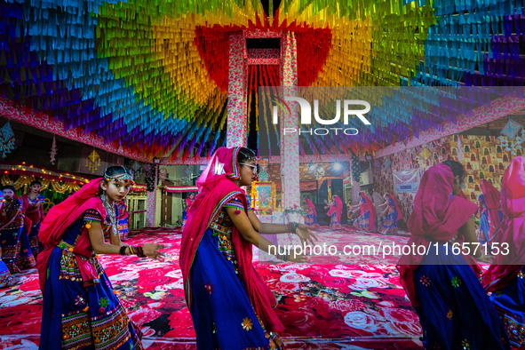 During Garbi organized by RA Garbi Mandal in Jamnagar, India, on Navratri, children worship Adhyashakti traditionally by performing the Raas...