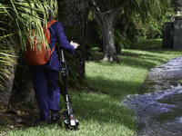 The street floods during Hurricane Milton in the Hunters Creek region, Florida, with water trapped between residents' homes and the lake, on...