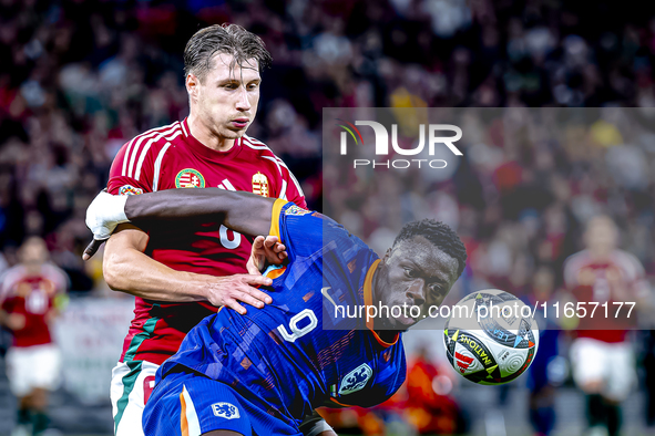 Hungary defender Willi Orban and Netherlands forward Brian Brobbey participate in the match between Hungary and the Netherlands at the Puska...