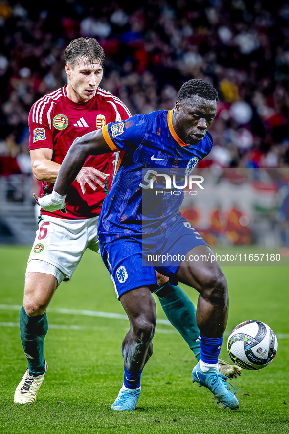 Hungary defender Willi Orban and Netherlands forward Brian Brobbey participate in the match between Hungary and the Netherlands at the Puska...