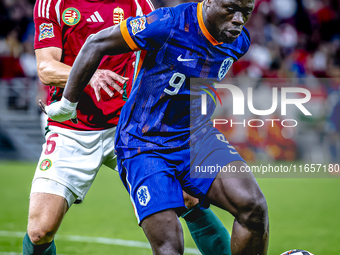 Hungary defender Willi Orban and Netherlands forward Brian Brobbey participate in the match between Hungary and the Netherlands at the Puska...