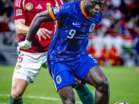 Hungary defender Willi Orban and Netherlands forward Brian Brobbey participate in the match between Hungary and the Netherlands at the Puska...