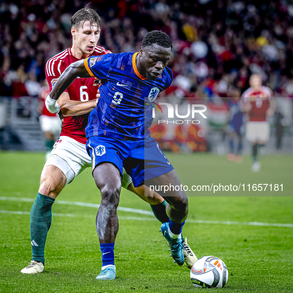 Hungary defender Willi Orban and Netherlands forward Brian Brobbey participate in the match between Hungary and the Netherlands at the Puska...