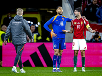 Netherlands forward Cody Gakpo and Hungary midfielder Dominik Szoboszlai play during the match between Hungary and the Netherlands at the Pu...