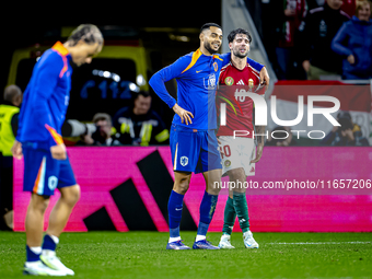 Netherlands forward Cody Gakpo and Hungary midfielder Dominik Szoboszlai play during the match between Hungary and the Netherlands at the Pu...