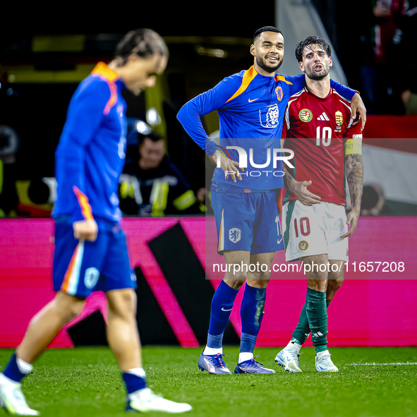 Netherlands forward Cody Gakpo and Hungary midfielder Dominik Szoboszlai play during the match between Hungary and the Netherlands at the Pu...