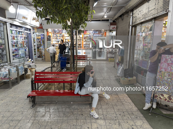 Iranian youths are at a shopping center in Shiraz, Iran, on October 8, 2024.  