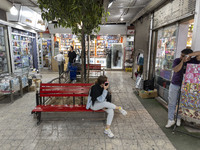 Iranian youths are at a shopping center in Shiraz, Iran, on October 8, 2024.  (