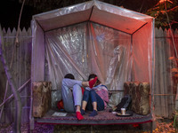 Iranian youths sit at a garden-cafe in Shiraz, Iran, on October 7, 2024.  (