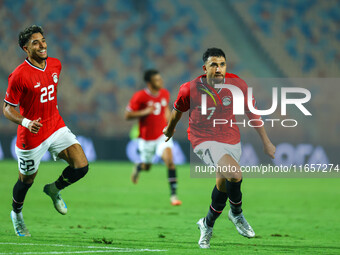 Egyptian national team player Mahmoud Hassan celebrates after scoring a goal during an Africa Cup of Nations qualifying match between Egypt...