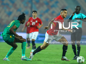 Mostafa Mohamed, a player of the Egyptian national team, is in action during an Africa Cup of Nations qualifying match between Egypt and Mau...