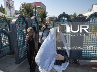 Veiled Iranian women arrive at a holy shrine in Shiraz, Iran, on October 8, 2024. While Western countries express concern about a potential...