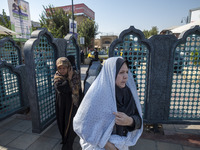 Veiled Iranian women arrive at a holy shrine in Shiraz, Iran, on October 8, 2024. While Western countries express concern about a potential...