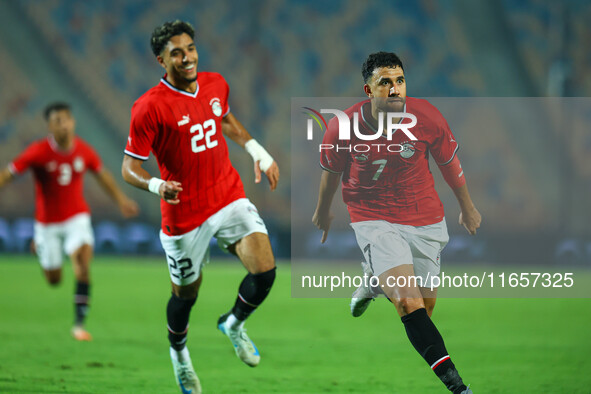 Egyptian national team player Mahmoud Hassan celebrates after scoring a goal during an Africa Cup of Nations qualifying match between Egypt...