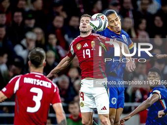 Hungary forward Barnabas Varga and Netherlands defender Virgil van Dijk play during the match between Hungary and the Netherlands at the Pus...