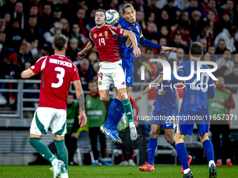 Hungary forward Barnabas Varga and Netherlands defender Virgil van Dijk play during the match between Hungary and the Netherlands at the Pus...