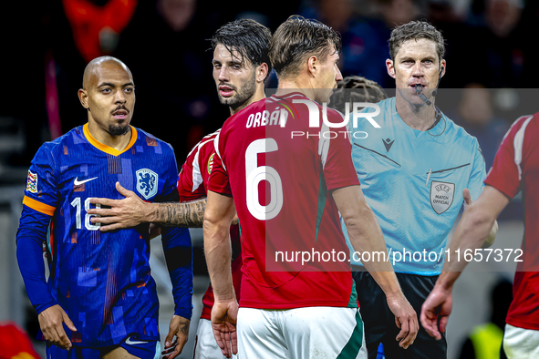 Netherlands forward Donyell Malen and referee Lukas Fahndrich are present during the match between Hungary and the Netherlands at the Puskas...