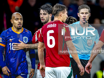 Netherlands forward Donyell Malen and referee Lukas Fahndrich are present during the match between Hungary and the Netherlands at the Puskas...