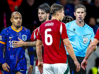 Netherlands forward Donyell Malen and referee Lukas Fahndrich are present during the match between Hungary and the Netherlands at the Puskas...