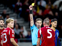 Hungary defender Attila Fiola receives a yellow card from Referee Lukas Fahndrich during the match between Hungary and the Netherlands at th...