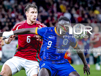 Hungary defender Willi Orban and Netherlands forward Brian Brobbey play during the match between Hungary and the Netherlands at the Puskas A...