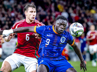 Hungary defender Willi Orban and Netherlands forward Brian Brobbey play during the match between Hungary and the Netherlands at the Puskas A...