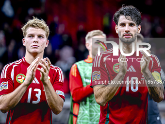 Hungary midfielders Andras Schafer and Dominik Szoboszlai play during the match between Hungary and the Netherlands at the Puskas Arena for...