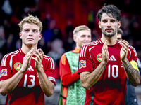 Hungary midfielders Andras Schafer and Dominik Szoboszlai play during the match between Hungary and the Netherlands at the Puskas Arena for...