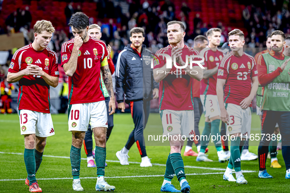 Hungary midfielders Andras Schafer, Dominik Szoboszlai, and Daniel Gera participate in the match between Hungary and the Netherlands at the...