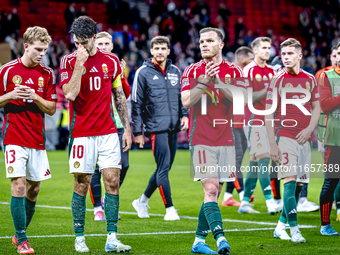 Hungary midfielders Andras Schafer, Dominik Szoboszlai, and Daniel Gera participate in the match between Hungary and the Netherlands at the...