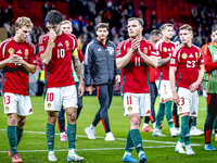 Hungary midfielders Andras Schafer, Dominik Szoboszlai, and Daniel Gera participate in the match between Hungary and the Netherlands at the...