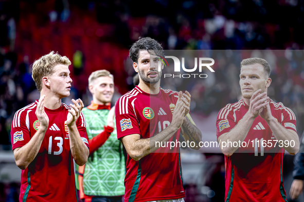 Hungary midfielders Andras Schafer, Dominik Szoboszlai, and Daniel Gera participate in the match between Hungary and the Netherlands at the...