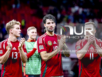 Hungary midfielders Andras Schafer, Dominik Szoboszlai, and Daniel Gera participate in the match between Hungary and the Netherlands at the...