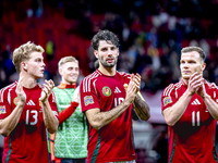 Hungary midfielders Andras Schafer, Dominik Szoboszlai, and Daniel Gera participate in the match between Hungary and the Netherlands at the...