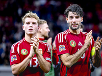 Hungary midfielders Andras Schafer and Dominik Szoboszlai play during the match between Hungary and the Netherlands at the Puskas Arena for...