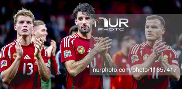 Hungary midfielders Andras Schafer, Dominik Szoboszlai, and Daniel Gera participate in the match between Hungary and the Netherlands at the...