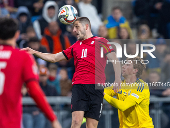 Giorgi Chakvetadze, Ivan Kaliuzhnyi are playing during the  UEFA Nations League 2024 League B Group B1 match between Ukraine and Georgia , a...