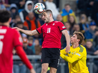 Giorgi Chakvetadze, Ivan Kaliuzhnyi are playing during the  UEFA Nations League 2024 League B Group B1 match between Ukraine and Georgia , a...