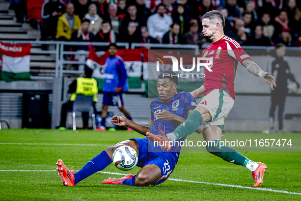 Netherlands defender Denzel Dumfries and Hungary midfielder Zsolt Nagy play during the match between Hungary and the Netherlands at the Pusk...