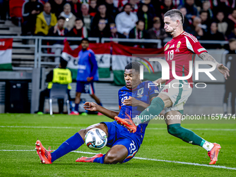 Netherlands defender Denzel Dumfries and Hungary midfielder Zsolt Nagy play during the match between Hungary and the Netherlands at the Pusk...