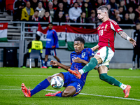 Netherlands defender Denzel Dumfries and Hungary midfielder Zsolt Nagy play during the match between Hungary and the Netherlands at the Pusk...