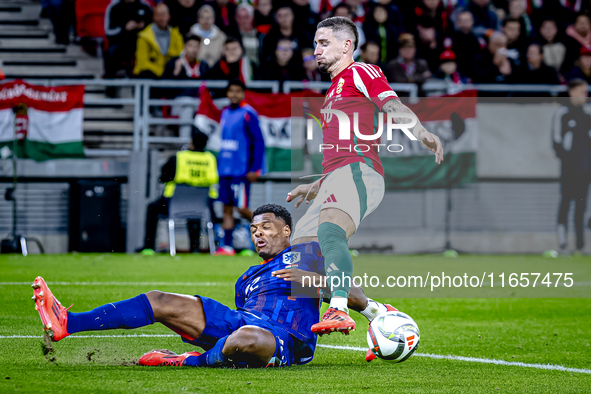 Netherlands defender Denzel Dumfries and Hungary midfielder Zsolt Nagy play during the match between Hungary and the Netherlands at the Pusk...