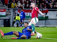 Netherlands defender Denzel Dumfries and Hungary midfielder Zsolt Nagy play during the match between Hungary and the Netherlands at the Pusk...