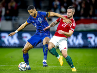 Netherlands forward Cody Gakpo and Hungary defender Endre Botka play during the match between Hungary and the Netherlands at the Puskas Aren...