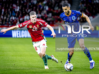 Hungary forward Roland Sallai and Netherlands forward Cody Gakpo participate in the match between Hungary and the Netherlands at the Puskas...